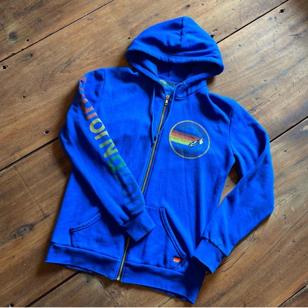 Aviator Nation Blue Hooded Jacket with Full-Length Zipper and Circular Emblem